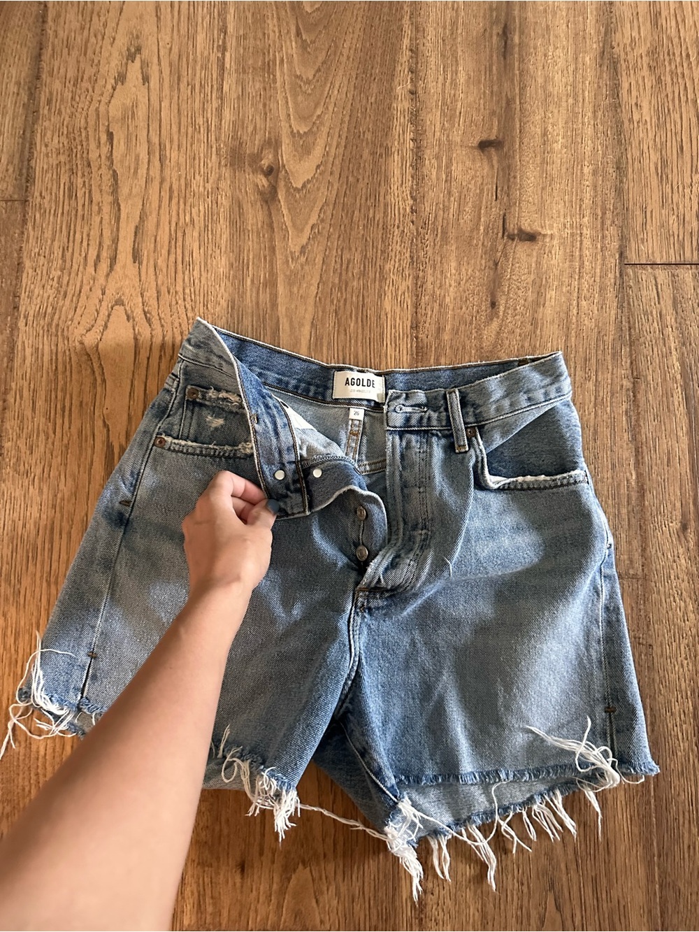 AGOLDE Medium Wash Distressed Frayed Denim Shorts